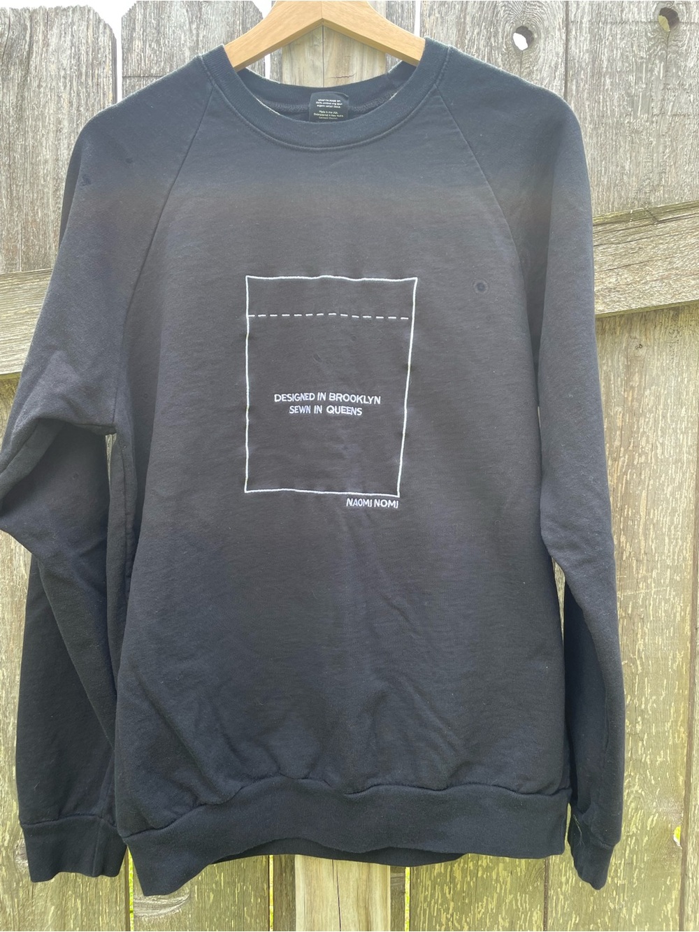 Black Crewneck Sweatshirt with Pocket Graphic